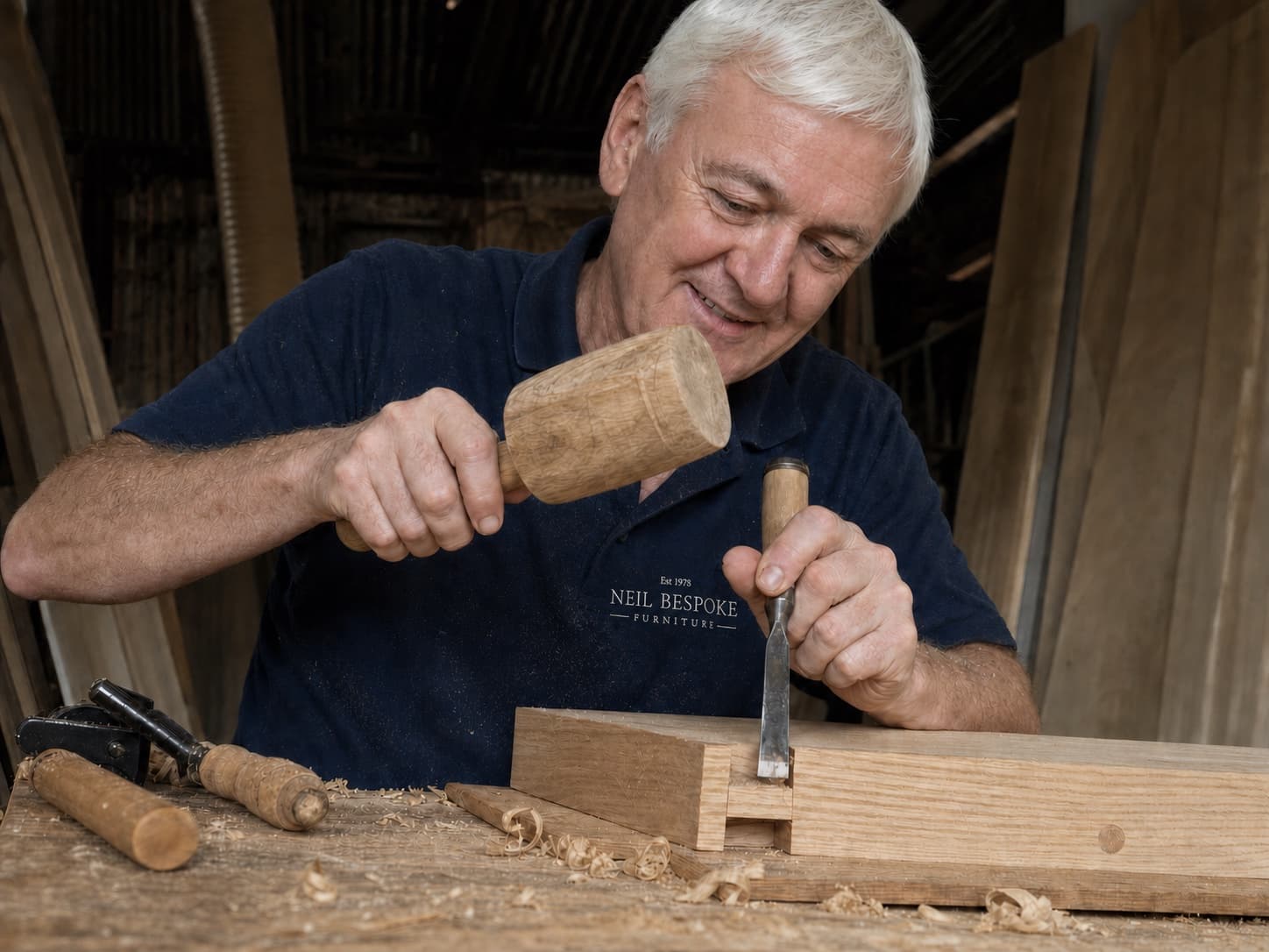 Neil cutting a timber joint by hand in his York workshop